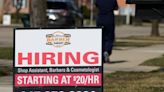 Applications for US unemployment benefits dip to 210,000 in strong job market