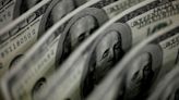 Dollar edges higher, buoyed by monetary policy imbalance