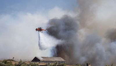 Firefighters tackle blazes on Greek islands of Chios and Kos