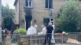 Woman dies and two kids fighting for life after 'suspicious' house fire