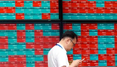 Stock market today: Asian shares decline after a mixed post-holiday session on Wall Street