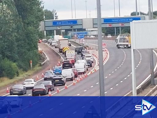 Two police among four in hospital after multi-car crash closes M8