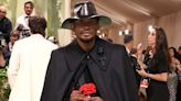 Usher Rocks All-Black 2024 Met Gala Fit — Complete with a Long Cape and Red Rose!