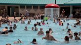 Many in Wayne & Holmes flood hotels, pools to escape heat as they await return of power