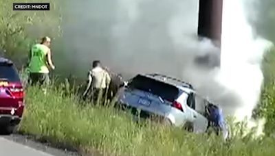 Video shows bystanders rescue driver from burning SUV on I-35W in Roseville