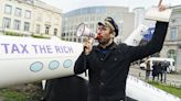 Activists outside EU Parliament demand higher taxes for super-rich