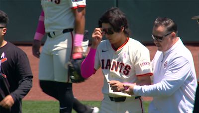 Lee exits Giants-Reds game after colliding with outfield wall
