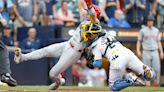 Perkins throws out tying run at the plate to secure series victory for Brewers against Reds