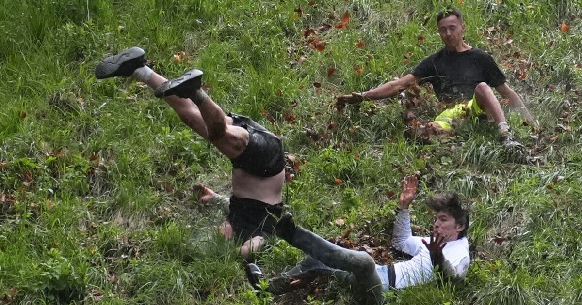 Best pictures from UK's crazy cheese rolling race