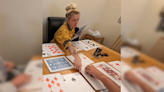 Mom buys playing cards for family trip, no one expects what she brings back