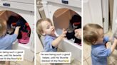 Toddler loves helping with laundry — until he’s given his favorite blanket