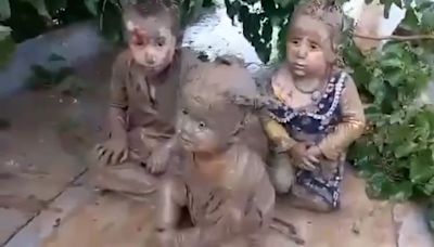 Children pulled from mud as hundreds die in severe flooding in Afghanistan