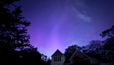 Photos show northern lights illuminating the sky around New England