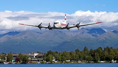 Vintage Douglas C-54 plane with 2 people on board crashes into Alaska riverbank