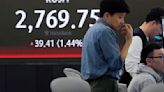 Stock market today: Asian shares advance after another round of Wall St records