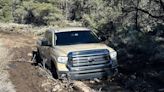 Driver gets stuck in mud on closed Death Valley road, photo shows. Rangers warn others