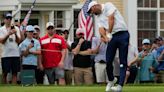 Tom Kim clings to a 1-shot lead over Scottie Scheffler in rain-delayed Travelers