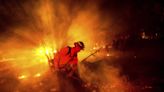 Firefighters gain ground against Southern California wildfire but face dry, windy weather