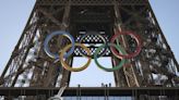 Paris Olympics organizers unveil a display of the five Olympic rings mounted on the Eiffel Tower