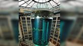 An enormous fish tank in a Berlin hotel lobby burst, spilling 250,000 gallons of water and likely killing all its 1,500 tropical fish