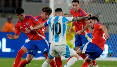 Lionel Messi, battered by Chile and ‘playing with pain,’ gets lift from Argentina teammates at Copa América