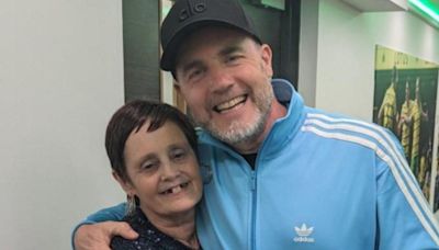Gary Barlow hugs woman, 62, catfished by scammer pretending to be him