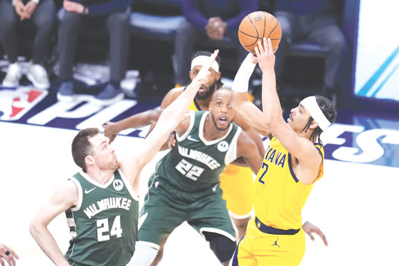 Indiana Pacers celebrate while sending Milwaukee Bucks packing to end their NBA playoff series Thursday