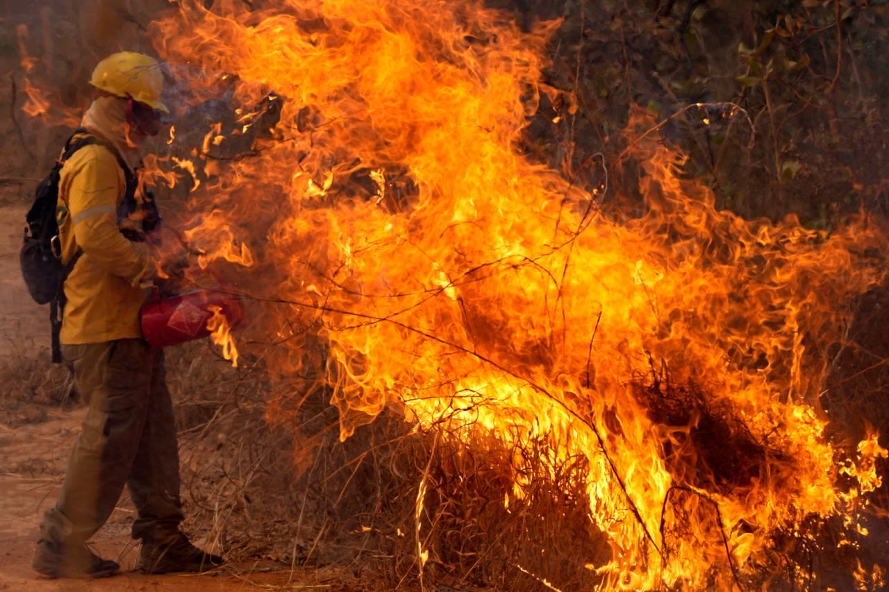 Amid the worst drought in Brazil history, wildfires rage and the Amazon falls to a record low level