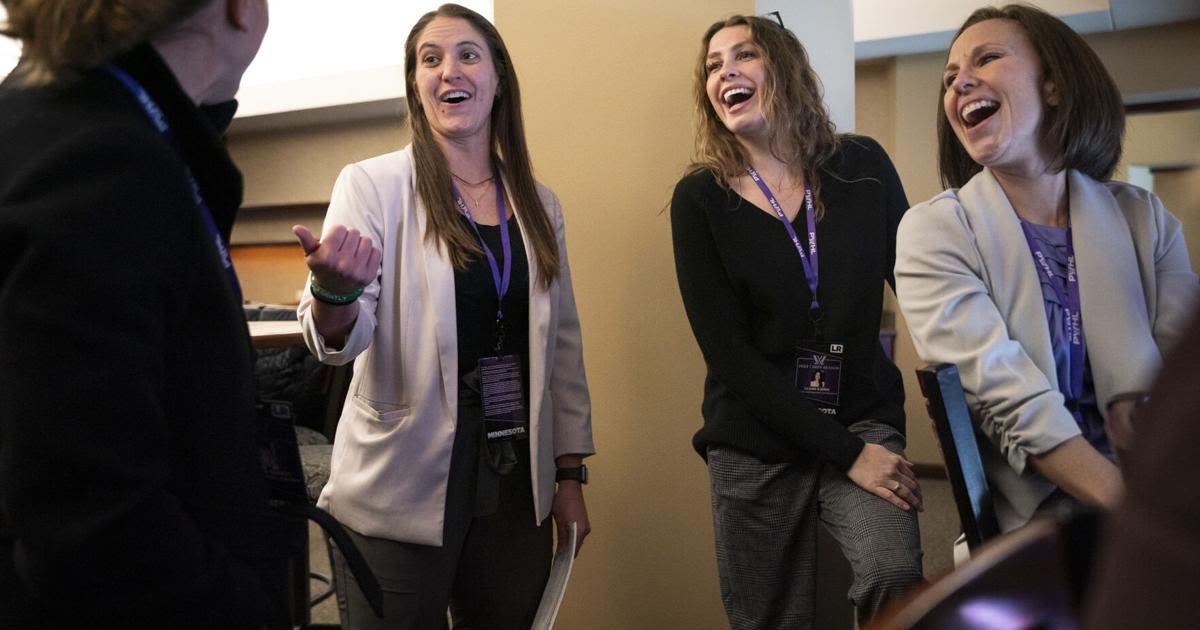 Natalie Darwitz, general manager of the PWHL's Minnesota team, laughs with some of the team's directors, from...and partner activation, Claire Bjerke, director of game operations and assistant to team services, and Emily Wood, director of team services, as they watch the game against Montreal from a suite in the Xcel Energy...