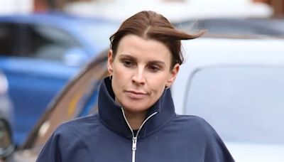 Coleen Rooney seems in good spirits as she heads to the gym in Cheshire wearing a navy jumper and leggings