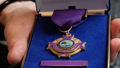 Manchester police officers honored with purple hearts