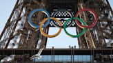 Paris Olympics organizers unveil a display of the five Olympic rings mounted on the Eiffel Tower