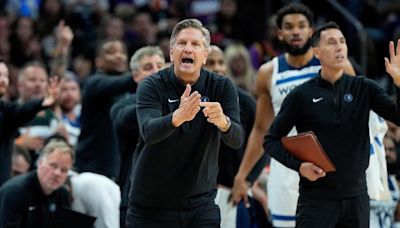 Minnesota Timberwolves coach Chris Finch has a torn patellar tendon after a collision with Mike Conley