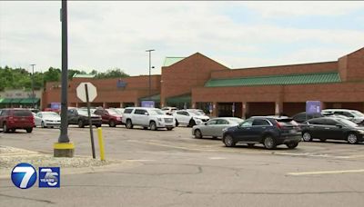 Worker injured in armed robbery at Kroger; Person of interest in custody