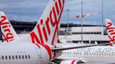 Man who 'ran through Virgin Australia plane naked and knocked over attendant' arrested