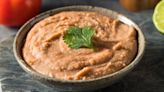 A Splash Of Acid Will Instantly Upgrade Canned Refried Beans