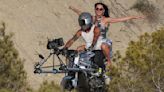 Katy Perry rides pillion on a motorbike while shooting her new video