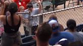 Check out this mom snagging a foul ball while holding onto a child!