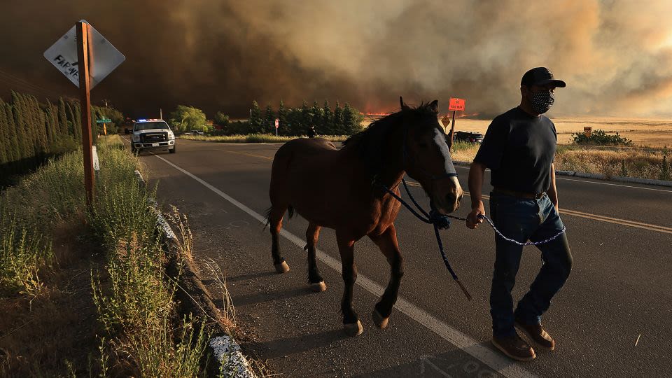A growing California wildfire spanning 14,000 acres is forcing residents to evacuate