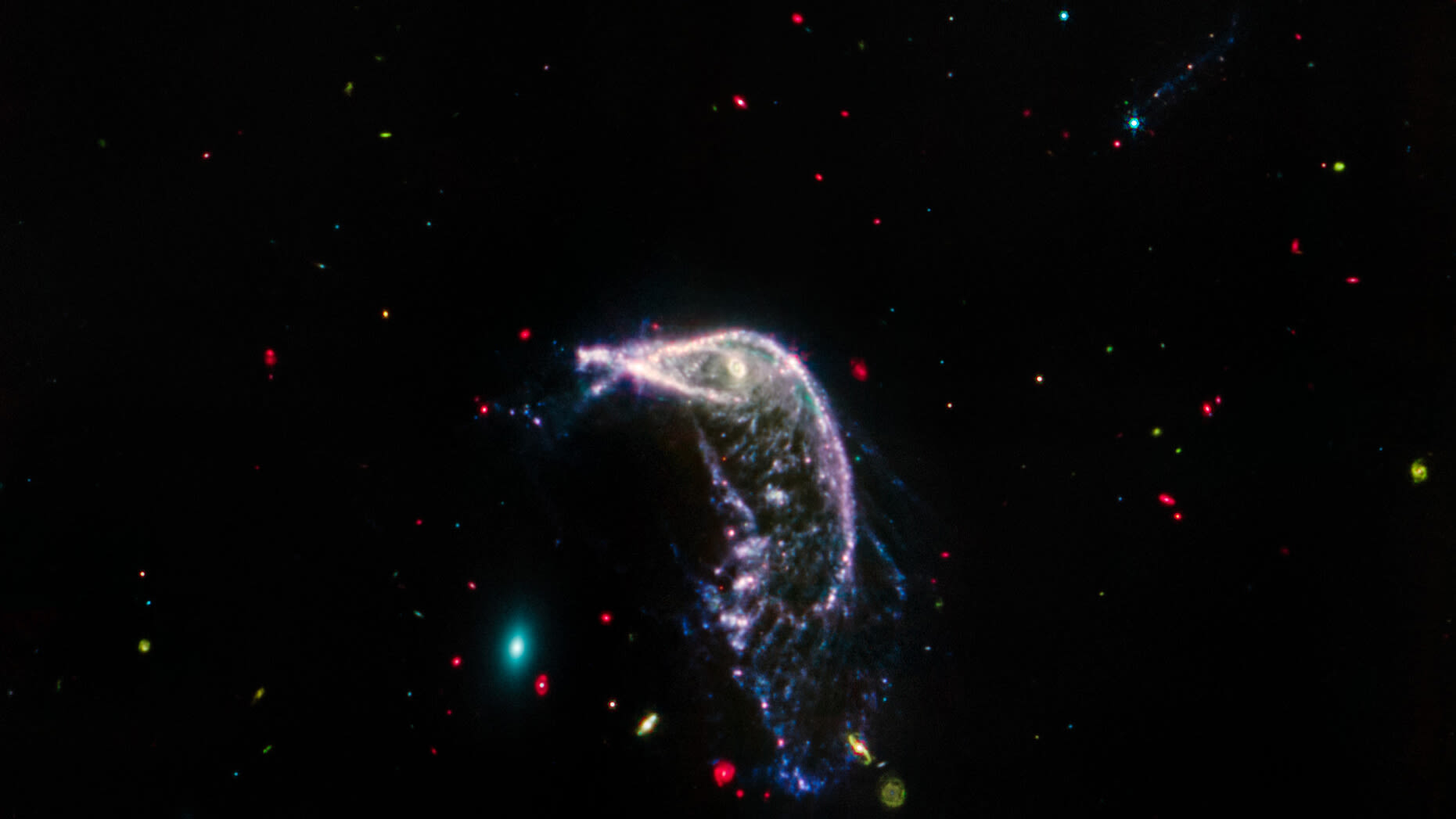 Photograph of the Penguin Galaxy chasing the Egg commemorates second space anniversary of the James Webb Space Telescope