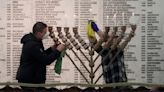 Far-right lawmaker extinguishes Hanukkah candles in Polish parliament