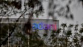 Exclusive-Adani made scheduled U.S. bond payments, to release credit report Friday -sources