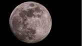 See December's Full Cold Moon shine in the sky like a Christmas ornament (photos)