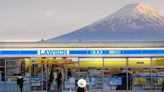 Japanese town overlooked by Mount Fuji erects screen to block tourists’ view