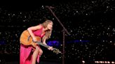 Taylor Swift Flashes Smile Singing About ‘Dating the Boy on the Football Team’ Amid Travis Romance