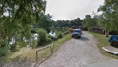 Pair arrested on suspicion of murder after man found dead in lake at holiday park in Dorset