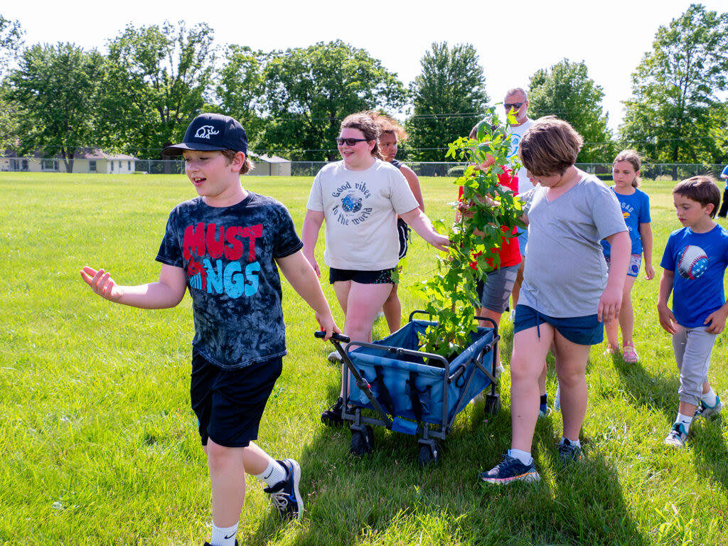 Kansas elementary school students plant exclusive sweetgum that traversed the moon