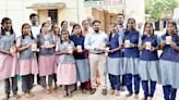 Students given piggy banks to save money for buying books at Book Fair