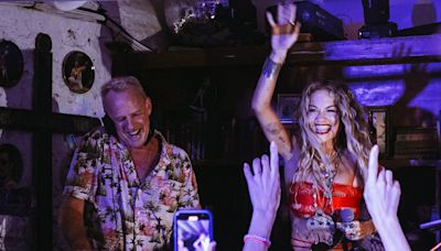 Rita Ora surprises Fatboy Slim as she joins him in Ibiza