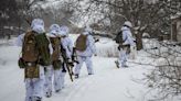 Ukrainian men trekking through mountains to dodge conscription